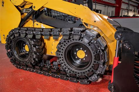 putting tracks on a wheeled skid steer|bobcat 753 over tire tracks.